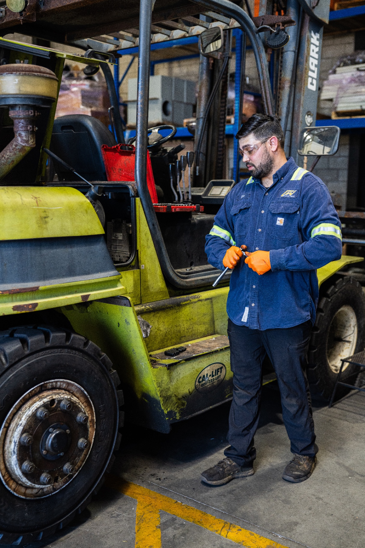 CW Industries technician performing on-site forklift service
